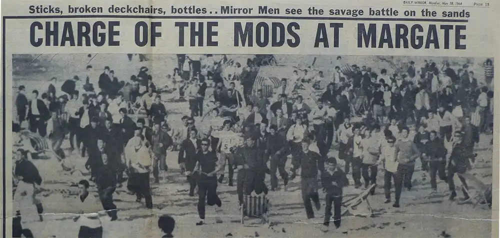 newspaper article showing riots at the beach