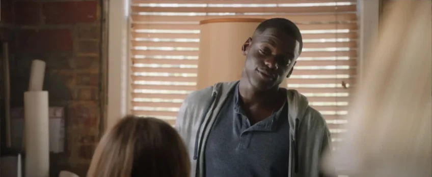 actor looking down at his girlfriend