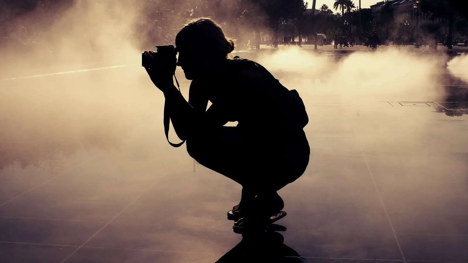 silhouette of girl taking a picture