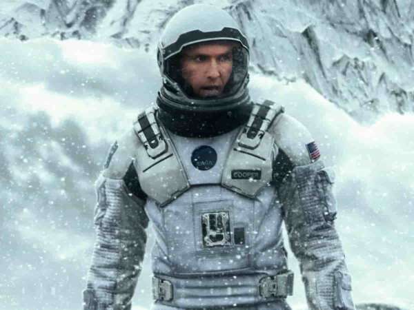 astronaut walks through an icy wasteland