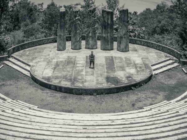 actor standing on ancient Greek stage