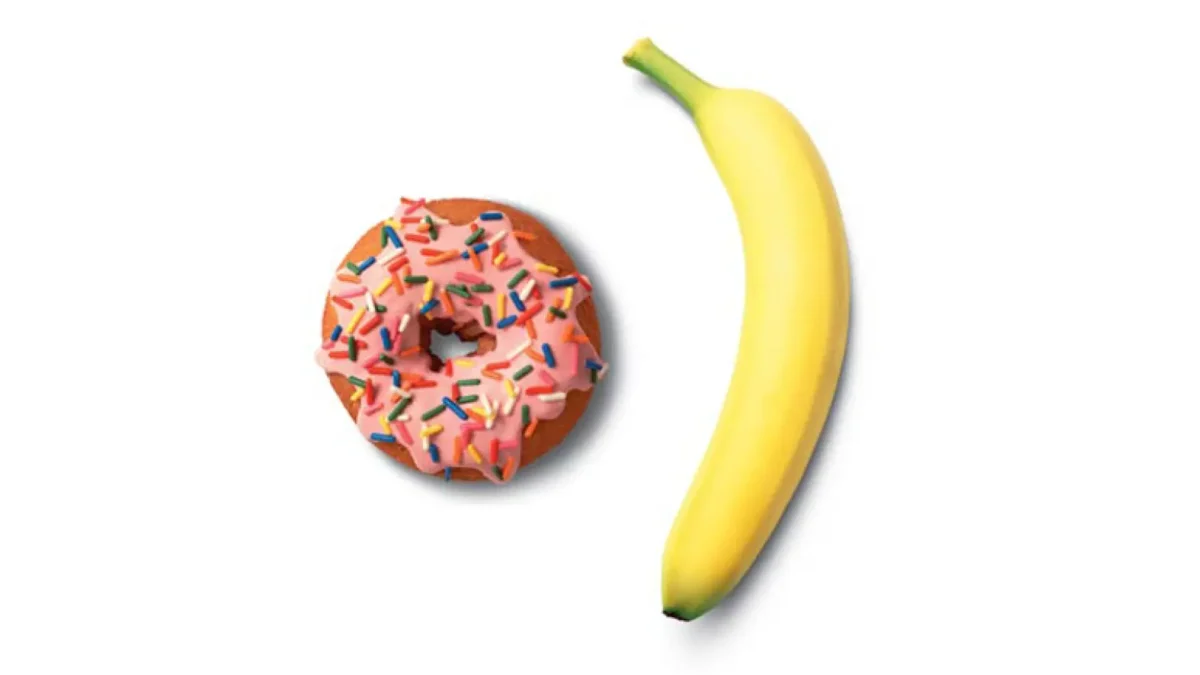 a donut and banana on a white background