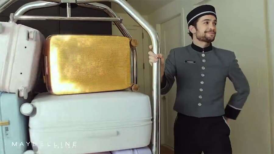 The gold suitcase in That Boss Life