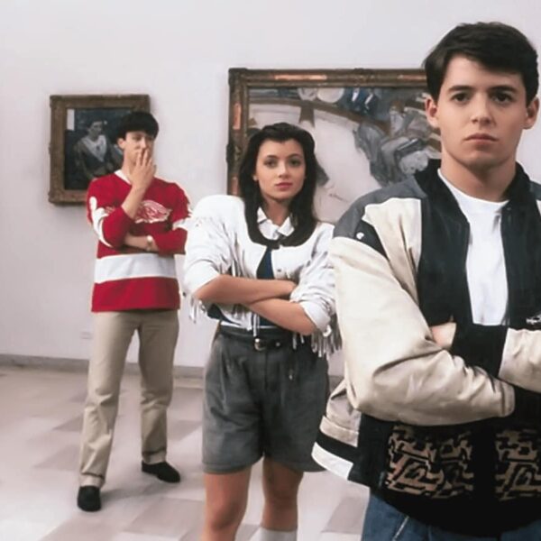 posing in front of modernist paintings