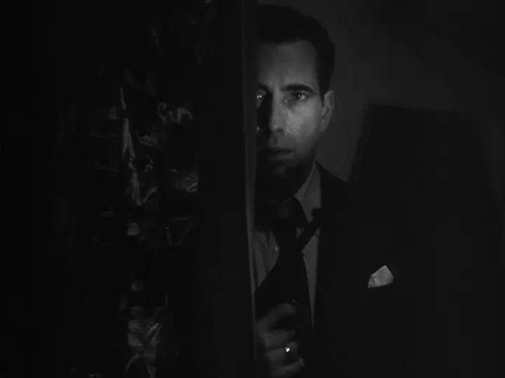 Bogart hides in the shadows