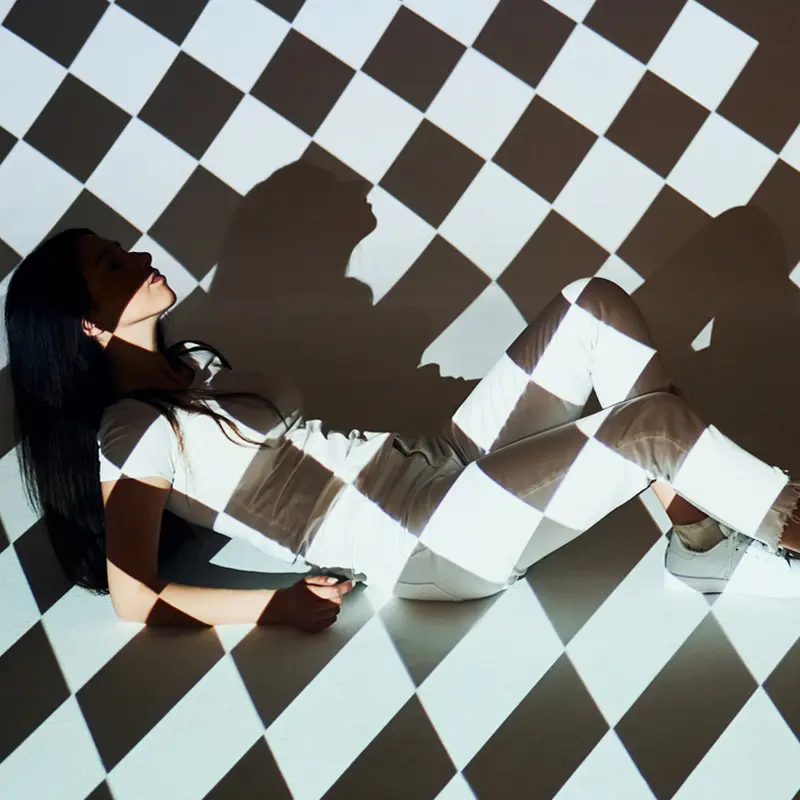 woman in black and white squares