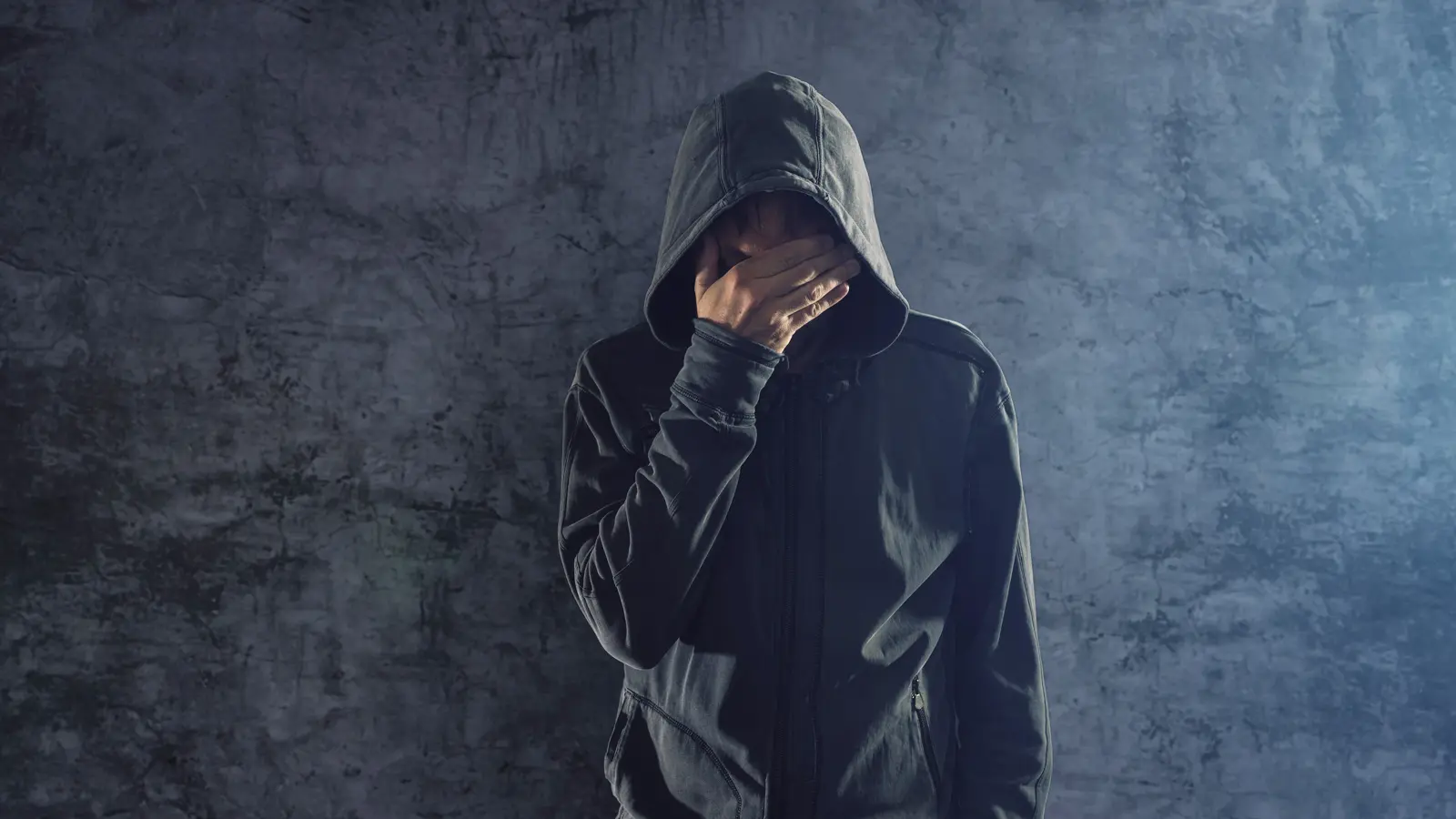 young person in a hoodie signifying desensitisation