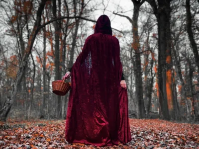 Red Riding Hood walking through the woods