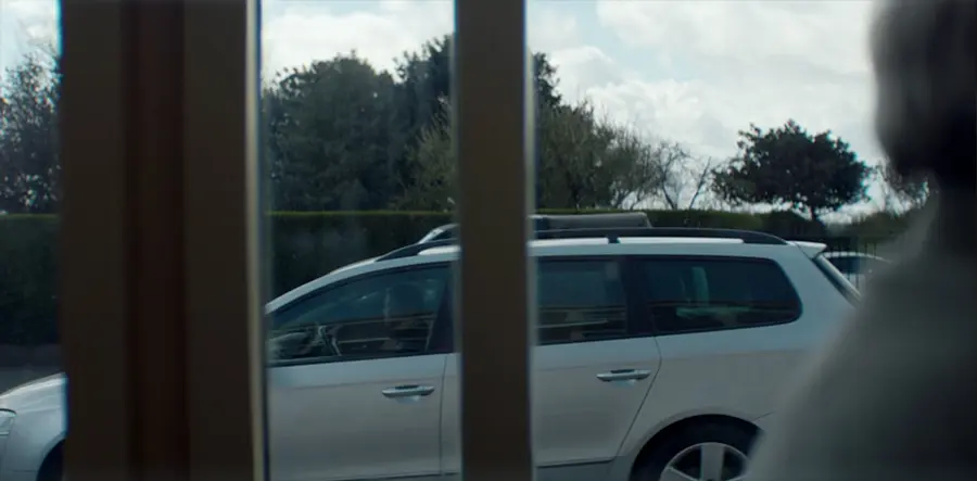 an estate car seen from behind a window