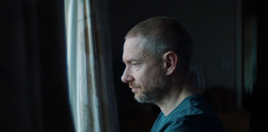 Chris looking out his bedroom window