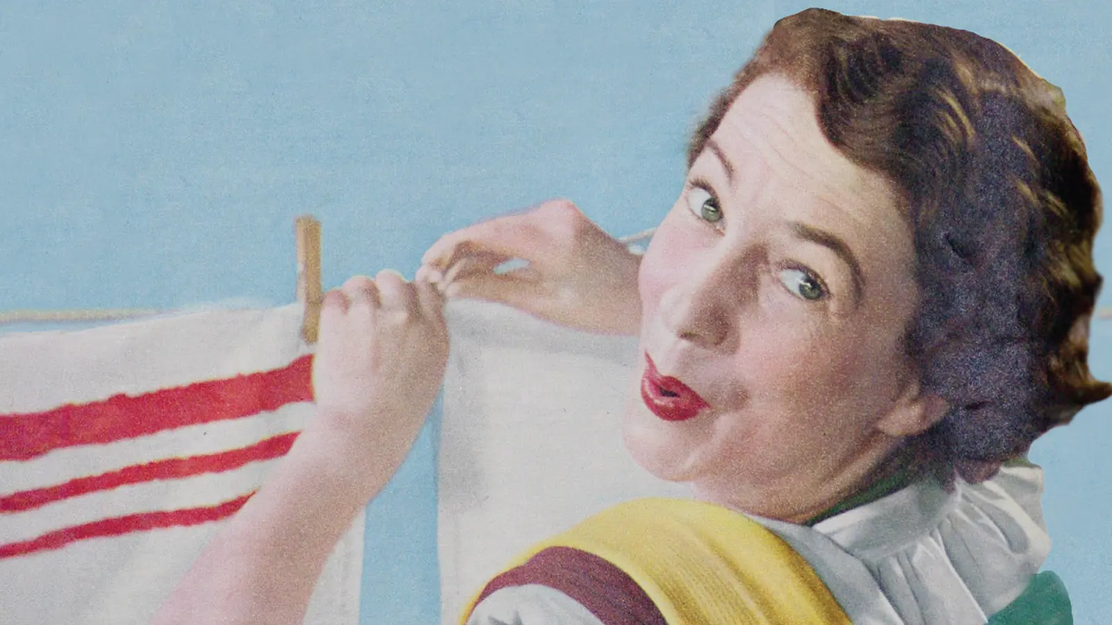 women hanging clothes on a washing line