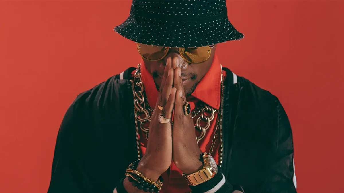 musician posing with his hands together