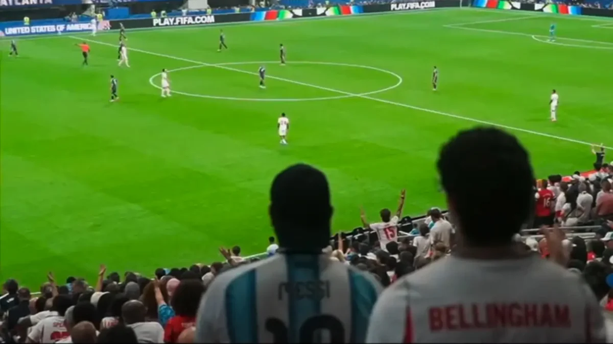 supporters watching the football game from the stands