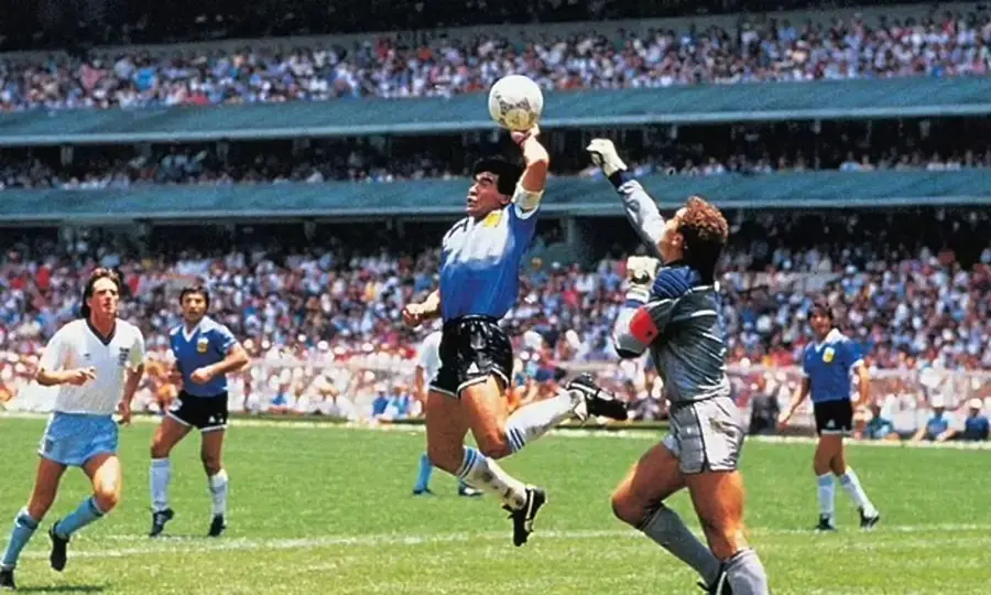Maradona punching the football